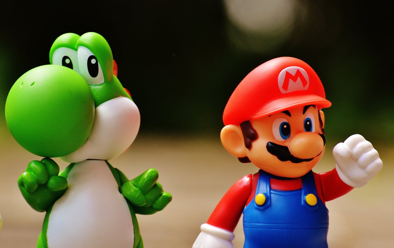 portfolio-01 Detailed close-up of Mario and Yoshi figurines from a popular video game franchise.