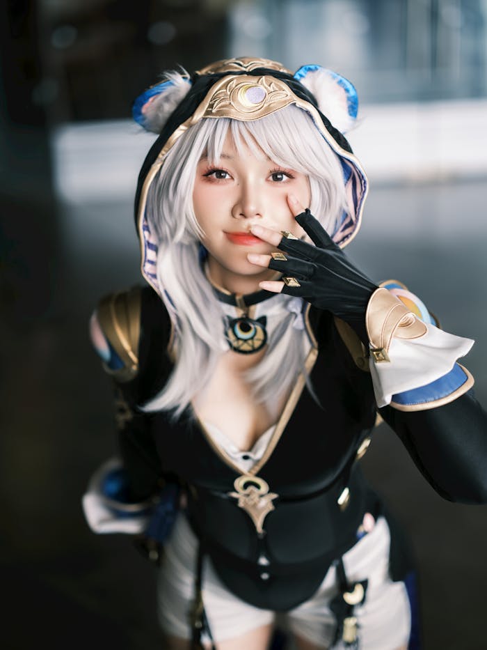 gallery-06 Cosplay enthusiast posing in a detailed fantasy costume indoors.